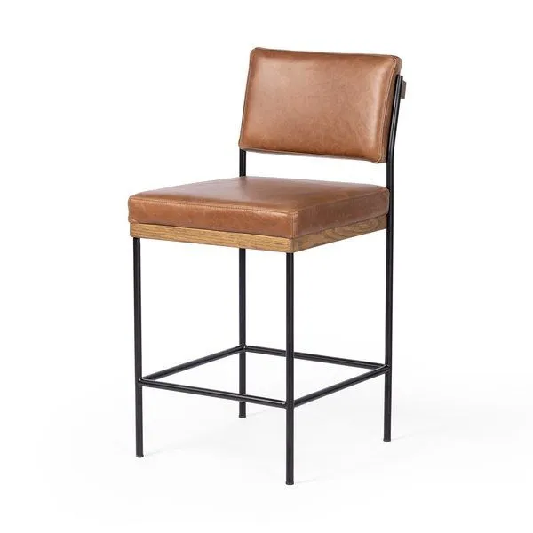 Benton stool angled view showcasing square wood base and leather cushion thickness