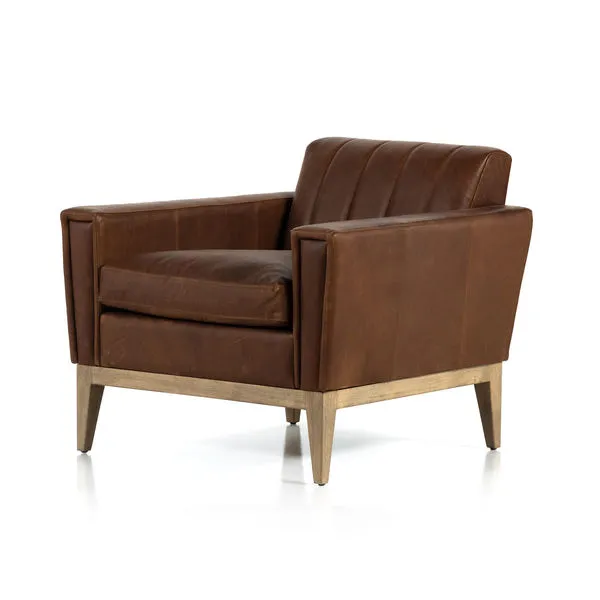 Roberts Heirloom Sienna chair in rich brown leather with curved back, plush cushion, and light wooden legs.