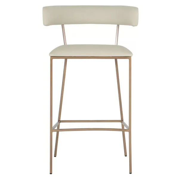 Full front view highlighting squared brass-finished metal legs and footrest