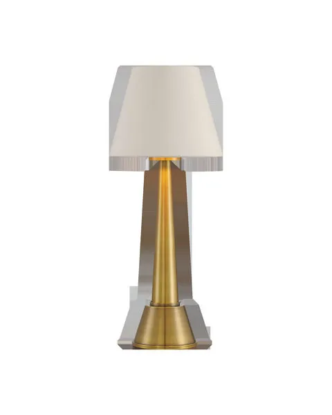 Gold cordless table lamp with polished brass cone base and cream shantung tapered drum shade