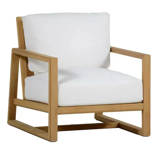 Mid-century teak lounge chair with a natural finish and white cushions on seat and backrest