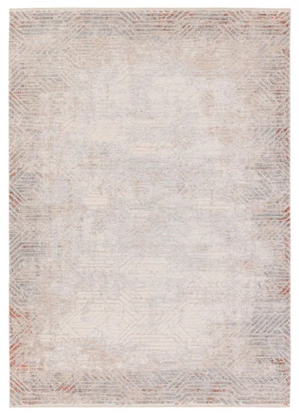 Modern rectangular area rug with geometric patterns in tan, gray, rust, and beige tones with cream fringe