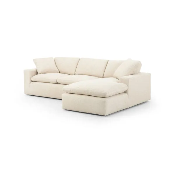 Cream-colored two-piece sectional with right arm facing chaise, oversized cushions, block arms, and feather-down cushioning