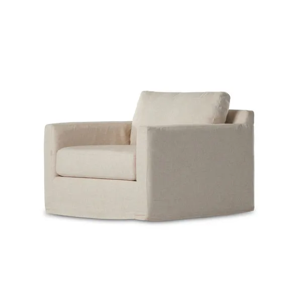 Neutral oatmeal slipcover swivel chair with a boxy shape and thick seat and back cushions