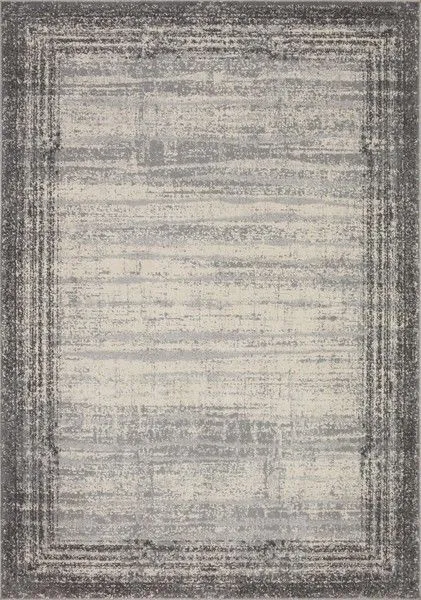 Austen Pebble / Charcoal modern rug with muted grey and charcoal tones and a textured, gradient border pattern.