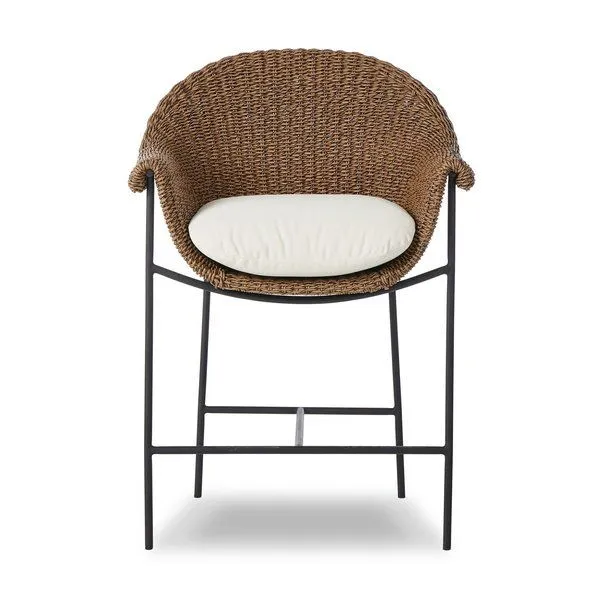 Outdoor counter stool with curvy woven frame, rolled arms, black iron base, and cream upholstered cushion