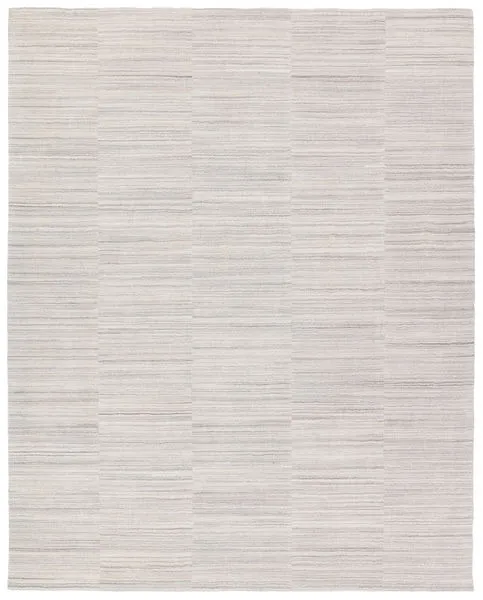 Irini handmade rug with subtle light gray, white, dark gray, and taupe stripes in a patchwork block pattern