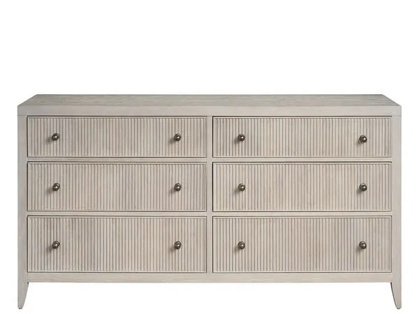 Carmen Dresser with six white oak drawers featuring vertical grooves and metal knobs in a light finish