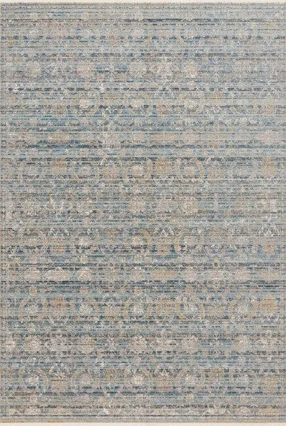 Traditional power-loomed rug with abstract and traditional motifs in muted gold, blue, and beige tones