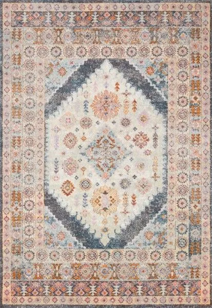 Classic rectangular vintage style rug with a large central medallion in soft blue, gray, orange, and cream hues