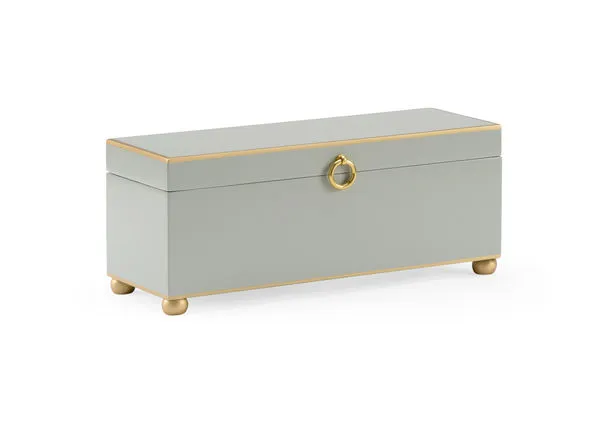 Rectangular gray wooden box with antique gold trim, bun feet, round gold metal handle, and hinged lid