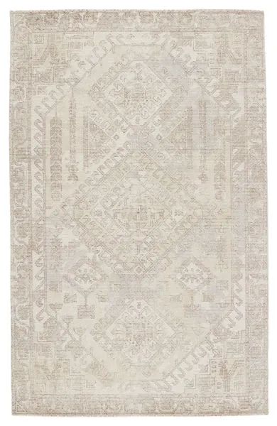 Light taupe and cream handwoven rug with geometric medallion design and soft, transitional tribal patterns