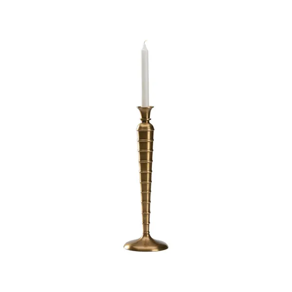 Tall Charlotte Candlestick with ribbed brass tapered silhouette holding a white taper candle