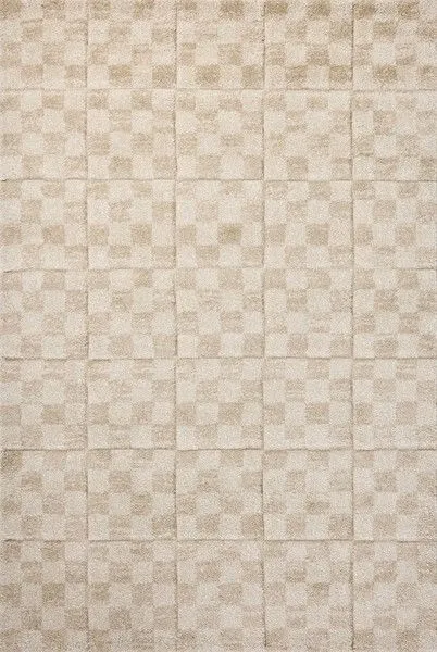neutral oatmeal and sand textured rug with softly distressed geometric checkered pattern and subtle black accents