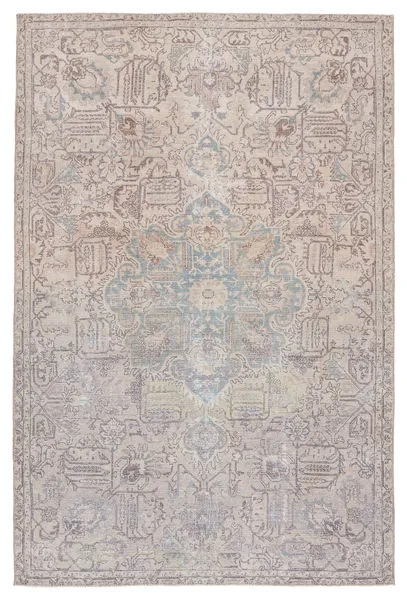 Traditional low-pile rug with a large light blue medallion center and tan, beige, gray vintage-inspired pattern