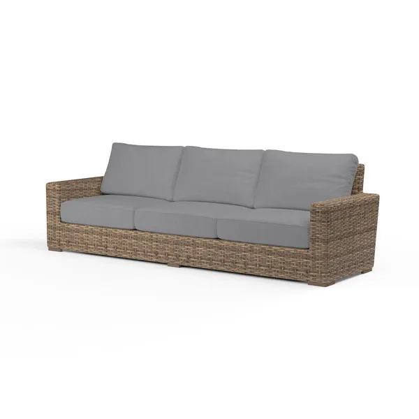 Outdoor Havana Sofa with weathered tobacco wicker frame and gray three-seat cushions