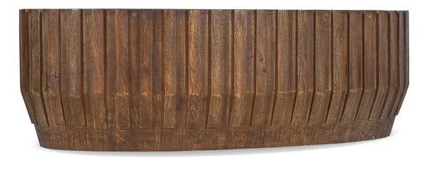 Oval Gears Cocktail Table in medium natural mango wood with ribbed gear motif and 58-inch width