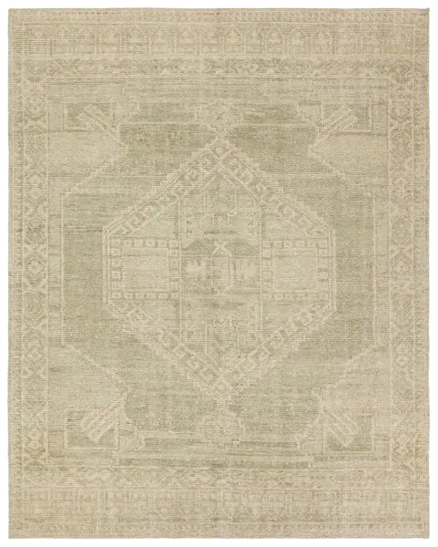 Handknotted traditional rug with vintage medallion design in muted green and cream, soft wool pile