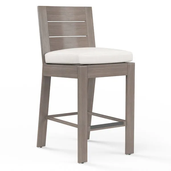 Laguna Barstool with hand-brushed aluminum finish mimicking driftwood, plank seat and back, white cushion