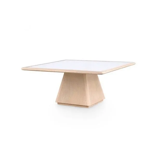 Square light oak wood coffee table with a white rattan inset tabletop and tapered pedestal base