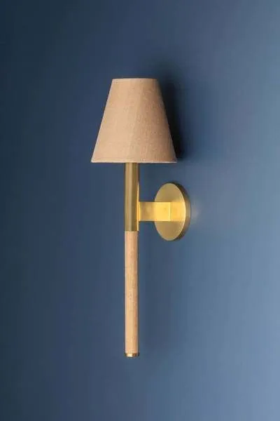 Side view of Lindenwood Wall Sconce showing brass arm extending from circular wall mount
