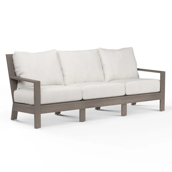 Laguna Sofa with driftwood-finish aluminum frame and white cushions, three-seat outdoor sofa design