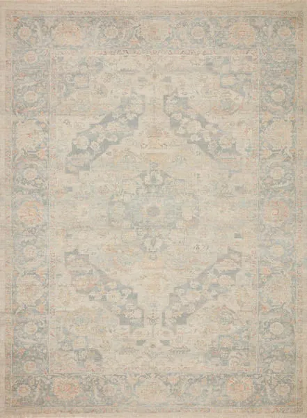full view of the rectangular rug displaying full faded floral medallion design in muted tones