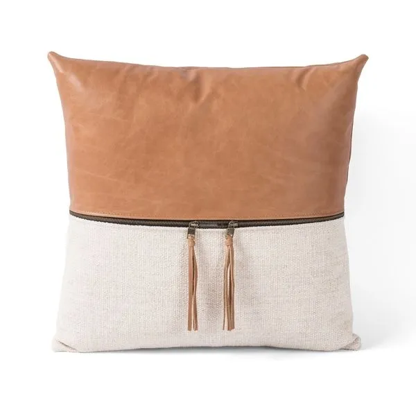 Square linen throw pillow with tan top-grain leather panel and leather zipper pulls across center