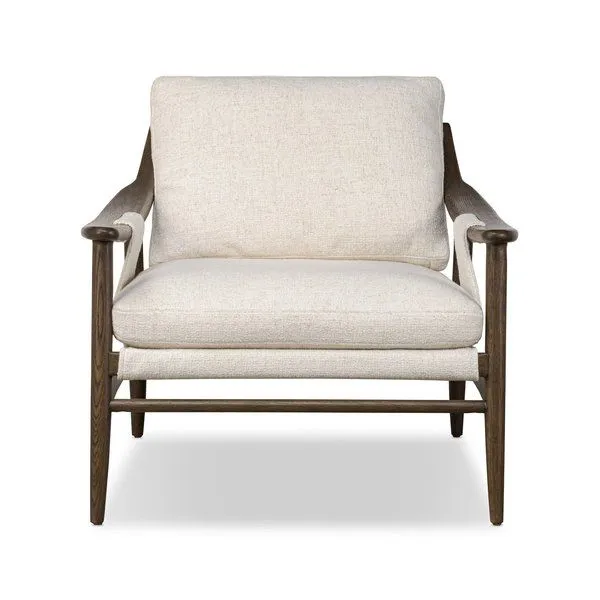 Kimmery Chair with thick-weave beige performance fabric, feather-fiber cushions, tapered oak legs, and arch stretchers