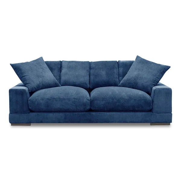 Plunge Sofa in deep blue corduroy fabric with plush seating cushions and two matching throw pillows
