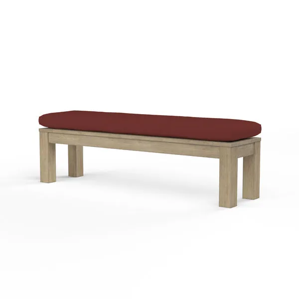Coastal Teak Dining Bench with sleek angular lines, warm grey teak wood and a rust-colored cushion