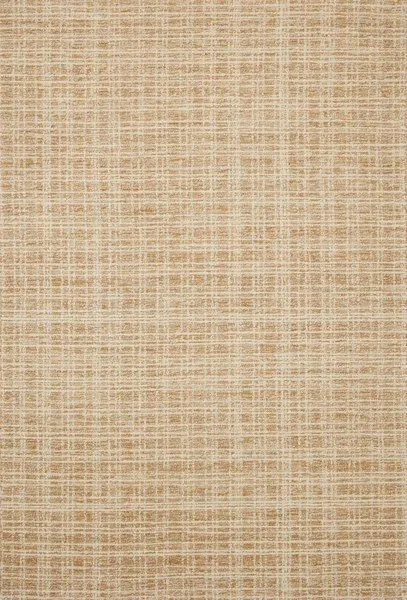 Ivory-colored Polly Straw rug with a hand-tufted wool and jute pile featuring a subtle gridded pattern