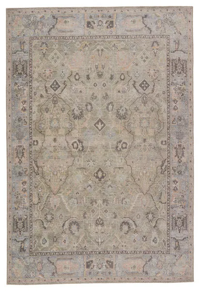 Low-pile traditional rug with faded green, blue, tan tones and an ornate Old World-inspired pattern