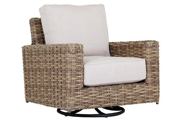 Outdoor swivel club rocker chair with weathered tobacco wicker frame and thick off-white seat and back cushions