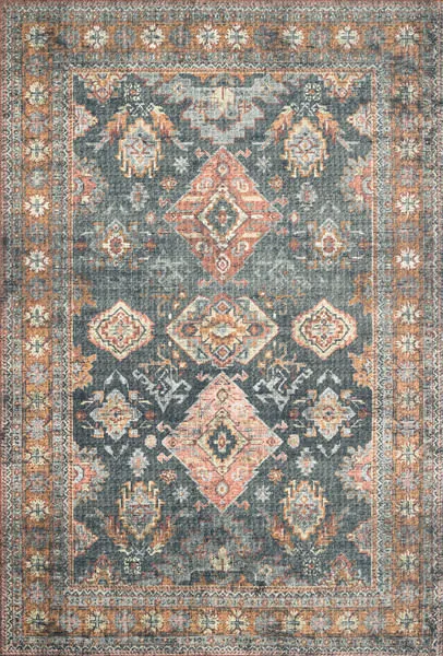 Traditional rectangular rug with faded rust, blue, and beige geometric and floral patterns in an old-world style