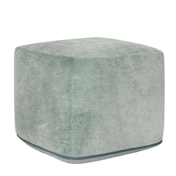 Stonewashed green velvet pouf with a cube shape and subtle texture on removable cover