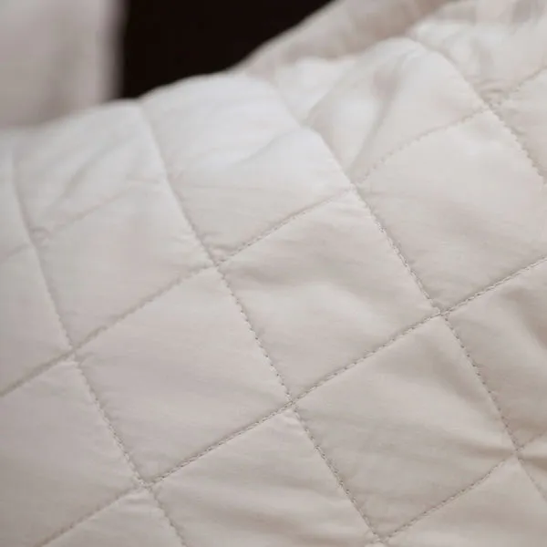 Close-up of Monaco coverlet showing diamond quilted pattern and smooth bamboo sateen texture