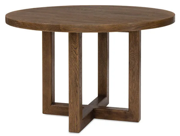 48-inch round dining table in worn saddle finish with deep burnished wood and interlocking pedestal base