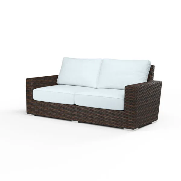 Montecito Loveseat with rich Cognac multi-colored resin wicker frame and white seat and back cushions