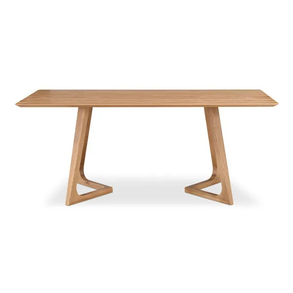 Rectangular solid oak dining table with mid-century modern angled legs and smooth natural wood finish
