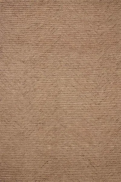 Hand-tufted wool area rug in rich earth tone with substantial ribbed pile and subtle linear textured pattern