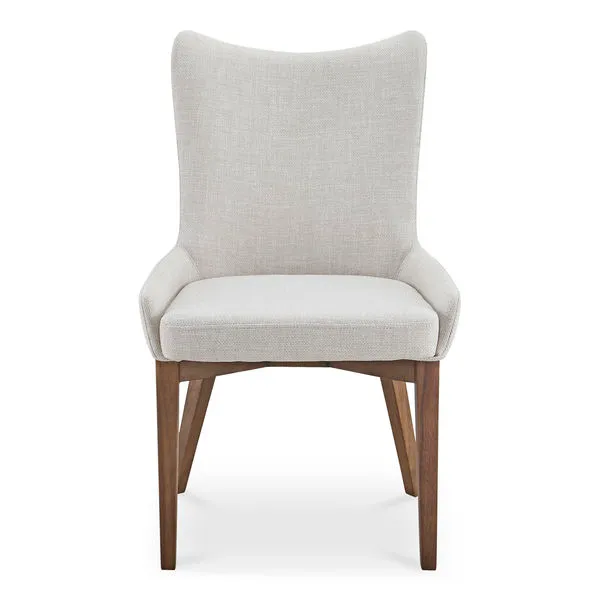 Posta dining chair with high curved back, padded seat in light beige fabric, and tapered walnut rubberwood legs