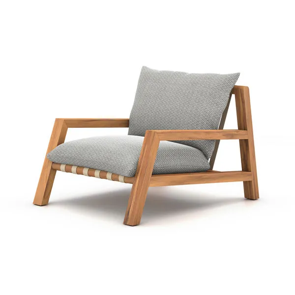 Soren Outdoor Chair with angular FSC teak frame, ash-colored cushions, ivory strap detailing under seat