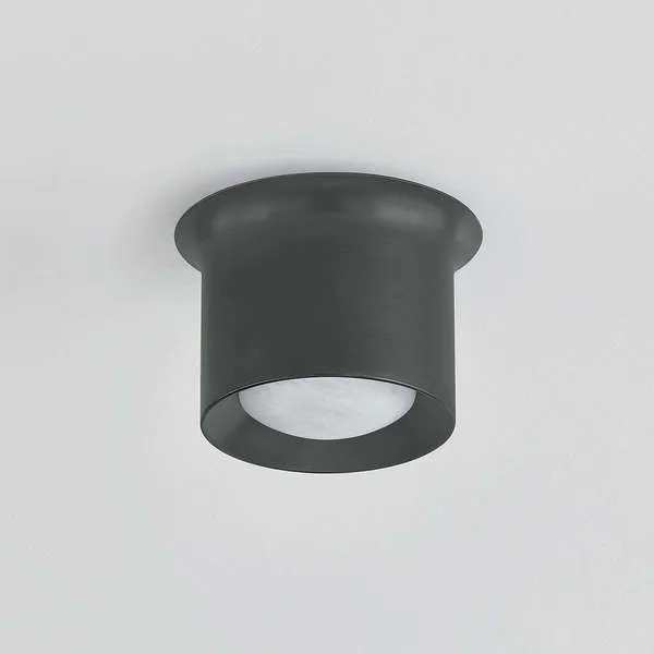 Noxon flush mount ceiling light with matte cloud glass shade and dark metal frame flowing into the ceiling