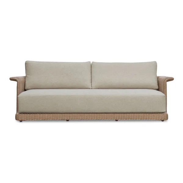Meredith outdoor sofa with curved armrests, beige cushions, and woven synthetic wicker base