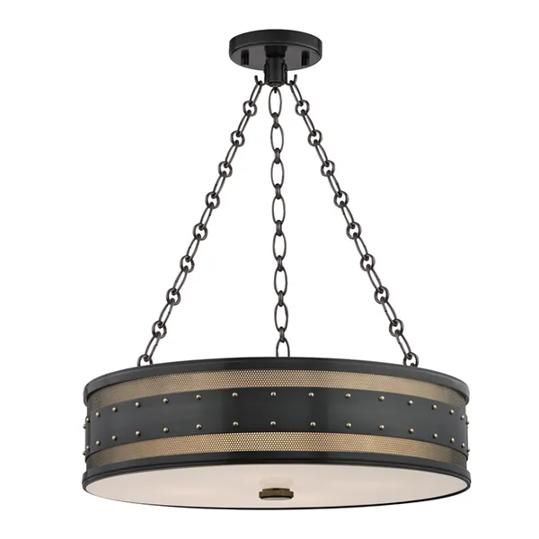 Round black metal pendant light with studded rivets, perforated brass metalwork, and frosted glass diffuser