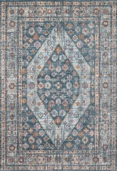 Vintage style Clara Blue rug with light blue and orange floral medallion pattern on a textured polypropylene surface