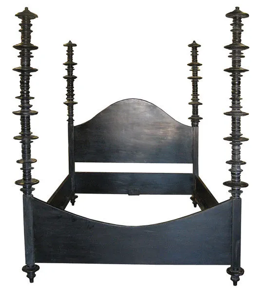 hand-carved black mahogany king bed with curved headboard and posts embellished with variegated mahogany discs