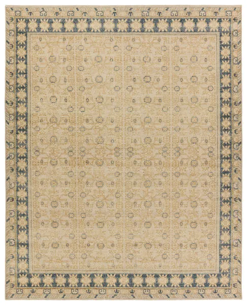 Hand-knotted traditional rug with tan background, blue floral trellis border, 8 by 10 feet size