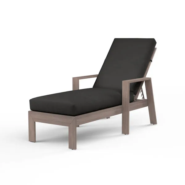 Laguna Chaise Lounge with hand-brushed driftwood-look aluminum frame and black cushioned seat and backrest